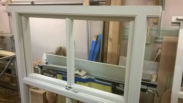 Newly manufactured painted timber window in a joinery workshop